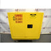 Front perspective view of yellow 22-gallon Uline flammable material storage cabinet showing double doors with warning labels and flush handle