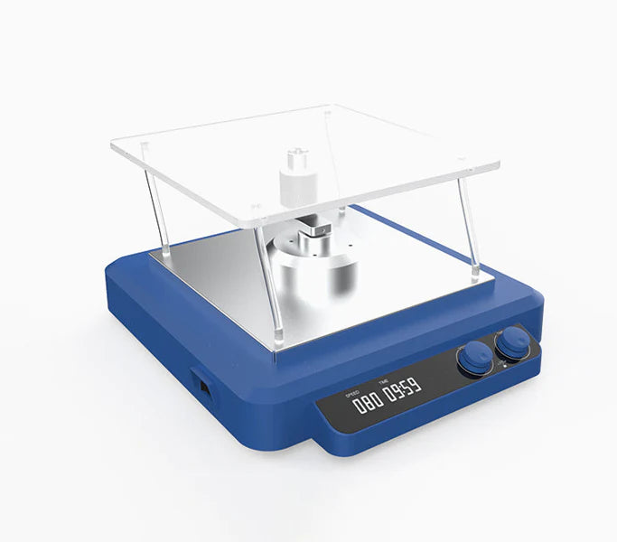A digital 3D rocker shaker with a blue base and a clear glass platform on top. It features a dial for speed control, a timer switch, and a digital display.