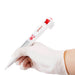 An electronic pipette held in a gloved hand, predominantly white with red and black detailing.