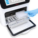 Studio product view of a gloved hand loading a deep-well plate onto the slide-out platform of a 4E's USA 32-throughput nucleic acid extraction system against a white background, highlighting its open internal sample chamber and metal handle