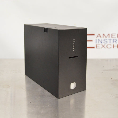Front angled perspective view of a 4E's USA CytoCube portable cell counter on a stainless steel surface, featuring its compact matte black housing, vertical indicator lights, sample insertion slot, and lower power button