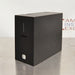 Left angled perspective view of a 4E's USA CytoCube portable cell counter on a stainless steel surface, highlighting its compact matte black housing, vertical status indicator lights, sample slot, and lower power button