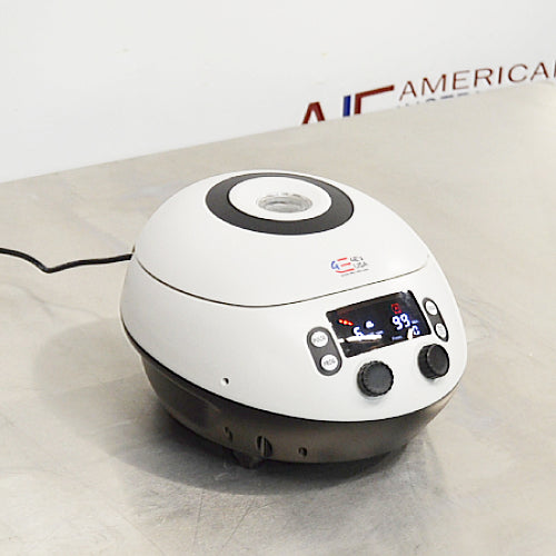 4E's USA brand new high speed micro centrifuge ka front angle view, jisme digital LED display screen, control knobs, brand logo, aur compact white-and-black housing saaf dikhai de rahe hain.   