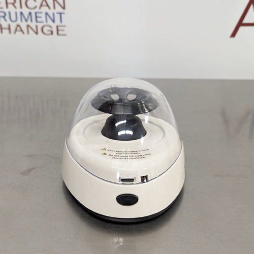 4E's USA brand new mini centrifuge ka back angle view, jisme rear power socket connection, safety latch mechanism, transparent dome lid, aur compact housing base saaf dikhai de rahe hain.   
