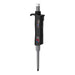Studio product view of a 4E's USA Per4mance adjustable single-channel pipette (20-200uL) against a white background, highlighting its black and gray ergonomic body, white plunger cap, and branding text