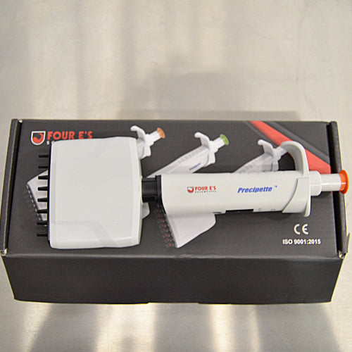 Product view of a 4E's USA Precipette 8-channel adjustable multichannel pipette (0.5-10uL) resting horizontally on top of its branded packaging box on a neutral surface, highlighting its white body and orange plunger cap
