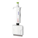 Studio product view of a 4E's USA Precipette 8-channel adjustable multichannel pipette (5-50uL) against a white background, highlighting its white ergonomic body, green plunger cap, and multi-tip lower module