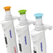 Close-up product view of three 4E's USA Precipette 8-channel adjustable multichannel pipettes showing their color-coded orange, green, and light blue plunger caps, ergonomic finger hooks, and digital volume displays covering 0.5uL to 300uL against a white background