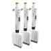 Studio diagonal lineup view of three 4E's USA Precipette 8-channel adjustable multichannel pipettes facing right featuring white ergonomic bodies and distinct color-coded orange, green, and light blue plunger caps covering volume capacities from 0.5uL to 300uL against a white background