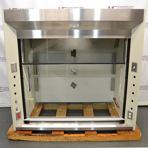 Front eye-level view of a 5-foot Jamestown bench fume hood mounted on a wooden pallet, featuring an open sash workspace, a stainless steel header and deck, and side utility panels with electrical outlets
