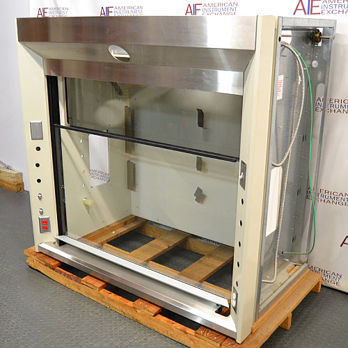 Left angled perspective view of a 5-foot Jamestown bench fume hood mounted on a wooden pallet, highlighting its stainless steel header, open glass sash, and left side control and utility panel