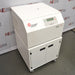 An alternative angled view of a Beckman Coulter Allegra V-15R refrigerated benchtop centrifuge system available from American Instrument Exchange, showing the centrifuge unit mounted on top of a matching mobile storage cart with locking cabinet doors and caster wheels.