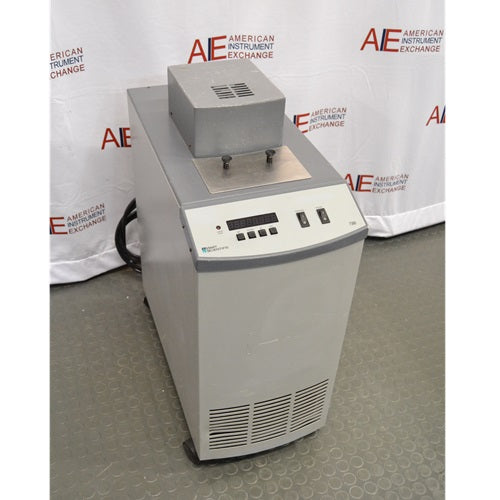 An alternative angled view of a Hart Scientific 7380 compact temperature calibration bath in front of an American Instrument Exchange backdrop, displaying its front display panel, side profile, and top access cover.