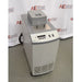An alternative angled view of a Hart Scientific 7380 compact temperature calibration bath in front of an American Instrument Exchange backdrop, displaying its front display panel, side profile, and top access cover.