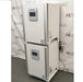 An alternative angled view of two stacked PHCbi Cell-IQ series tri-gas cell culture incubators available from American Instrument Exchange, showing the units from a side-angle perspective.