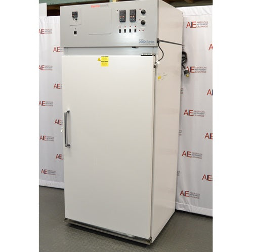An alternative angled view of a Thermo Forma 3940 refrigerated environmental chamber in front of an American Instrument Exchange backdrop, displaying its closed white door, right side panel, and top grey control console.
