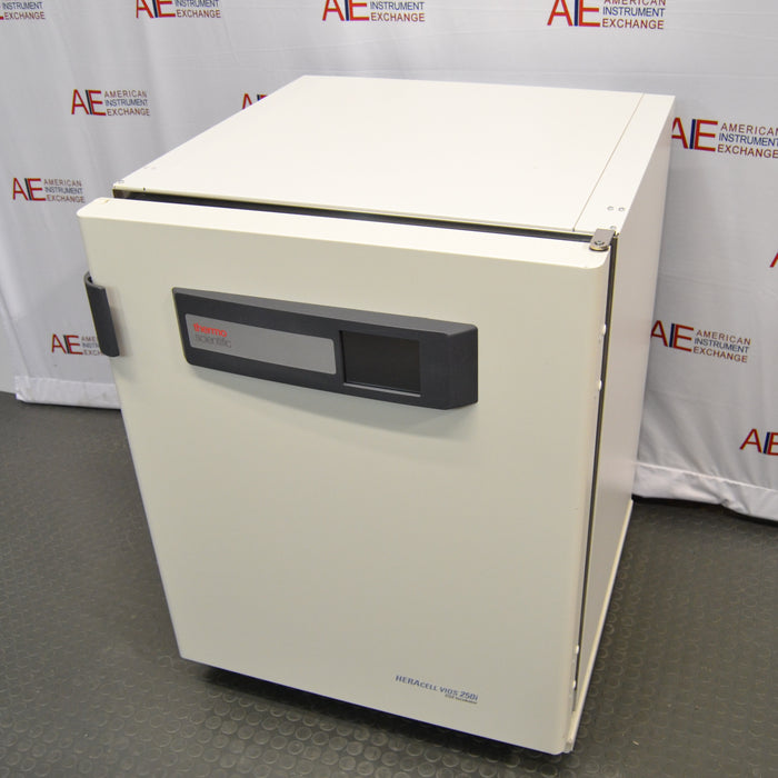 An alternative angled view of a Thermo Heracell VIOS 250i copper-lined incubator available from American Instrument Exchange, showing its solid outer door, central branding panel, and digital display interface.