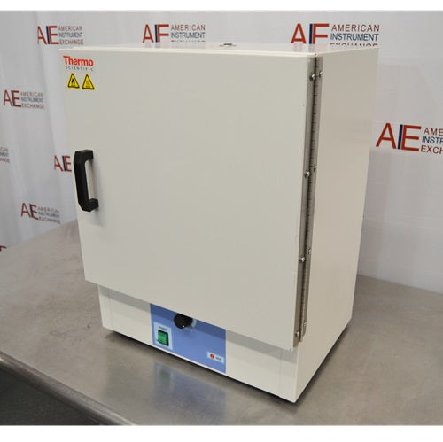 An alternative angled view of a Thermo Scientific PR305225G Precision laboratory oven sitting on a stainless steel surface in front of an American Instrument Exchange backdrop, highlighting its right side panel, door hinges, front handle, and blue control panel.