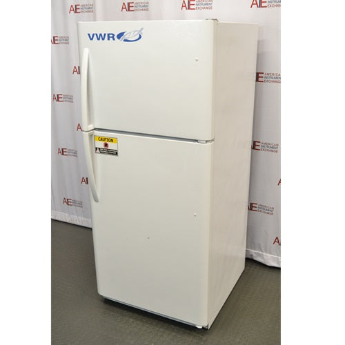 An alternative angled view of a white VWR general purpose laboratory refrigerator/freezer combo in front of an American Instrument Exchange backdrop, showing its front doors, right side panel, vertical handles, and caution label.