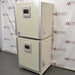 Angled view showing side panels of stacked Panasonic cellIQ CO2 laboratory incubators on a rolling caster base