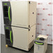An angled view of the stacked Caron 6010-1 environmental chamber units, displaying their beige and charcoal-grey design with bright green accents, accompanied by the condensate recirculator in front of an American Instrument Exchange backdrop.