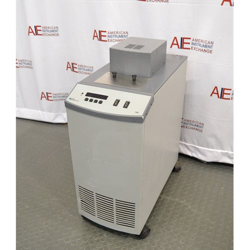 An alternative angled view of a Hart Scientific 7380 compact temperature calibration bath in front of an American Instrument Exchange backdrop, showing its front controls, side cabinet, and top access port.