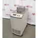 An alternative angled view of a Hart Scientific 7380 compact temperature calibration bath in front of an American Instrument Exchange backdrop, showing its front controls, side cabinet, and top access port.