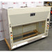 An angled view of the cream-colored Kewaunee 6-foot chemical fume hood, highlighting its sliding glass sash, utility controls, and metal structure against an American Instrument Exchange backdrop.