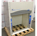 An angled view of a Labconco Protector Premier chemical fume hood mounted on a wooden pallet in front of an American Instrument Exchange backdrop, highlighting the left side panel, Premier branding, clear glass sash, and side utility controls.