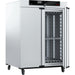 Angled view of Memmert UF1060 forced convection universal oven with right door open showing inner chamber shelving
