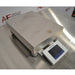 An alternative angled view of a Mettler Toledo XSR32001DR laboratory balance available from American Instrument Exchange, showing its large weighing pan and front-mounted digital touchscreen display.