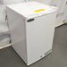 Angled view of Norlake Scientific undercounter laboratory refrigerator showing top warning sticker and front door logo