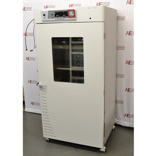 Angled front-right view of a closed, white Shel Lab 2428 CO2 incubator showing the glass window and right side panel.