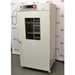 Angled front-right view of a closed, white Shel Lab 2428 CO2 incubator showing the glass window and right side panel.