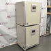 Angled view of stacked Panasonic cellIQ CO2 laboratory incubators on a rolling caster base