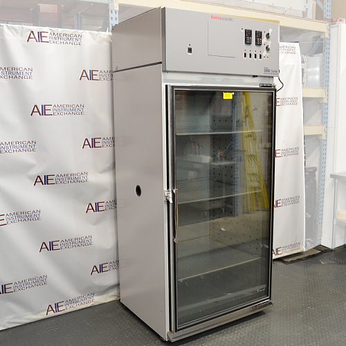An angled view of a Thermo Forma 3940 refrigerated environmental chamber available from American Instrument Exchange, featuring a glass door and top control panel.