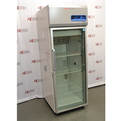 An alternative angled view of a Thermo Scientific TSX2305CA chromatography refrigerator available from American Instrument Exchange, showing its full-length glass door, wire interior shelving, and top-mounted digital control console.