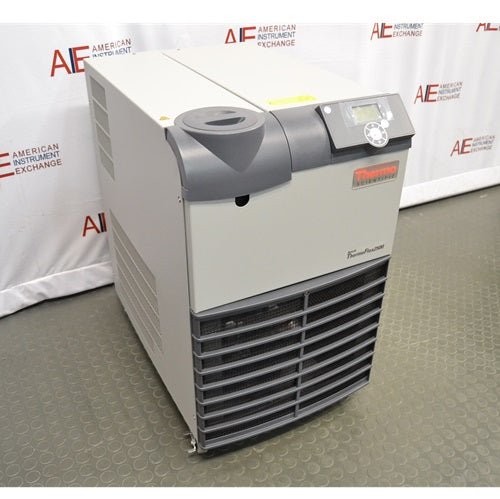 An angled view of the Thermo Scientific ThermoFlex 2500 recirculating chiller, highlighting the top control interface, beige housing, and front ventilation grille against an American Instrument Exchange backdrop.