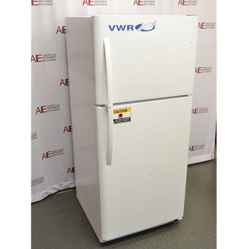 An angled view of a white VWR general purpose laboratory refrigerator/freezer combo in front of an American Instrument Exchange backdrop, showing its front doors, left side panel, vertical handles, and caution label.