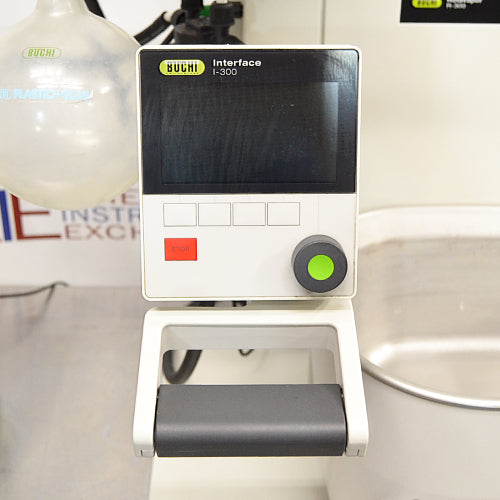 Buchi Rotovapor R-300 rotary evaporator system set on a table, with components including a glass flask, metal stands, and electronic interfaces.