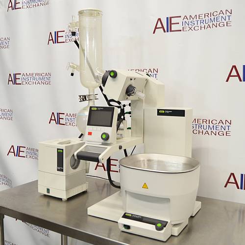 Buchi Rotovapor R-300 rotary evaporator system set on a table, with components including a glass flask, metal stands, and electronic interfaces.