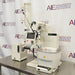 Buchi Rotovapor R-300 rotary evaporator system set on a table, with components including a glass flask, metal stands, and electronic interfaces.