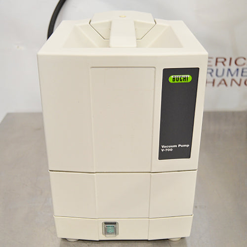 Buchi Rotovapor R-300 rotary evaporator system set on a table, with components including a glass flask, metal stands, and electronic interfaces.