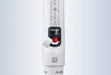 A close-up view of the handle of a white BRANDTECH Transferpette S pipette with its white protective cover flipped open, exposing the red calibration mechanism below the digital volume display window.