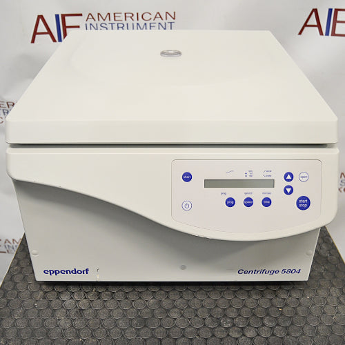an Eppendorf Centrifuge 5804 on a textured surface with a white housing, closed lid, and blue control panel.