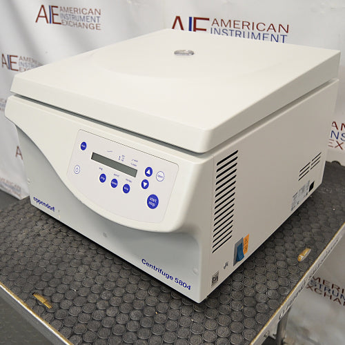 an Eppendorf Centrifuge 5804 on a textured surface with a white housing, closed lid, and blue control panel.