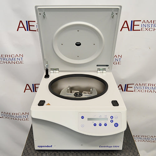 an Eppendorf Centrifuge 5804 on a textured surface with a white housing, closed lid, and blue control panel.