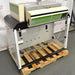Erlab M481 Captair Flex Ductless Fume Hood positioned on a wooden pallet, featuring a digital control panel, transparent front, and a green and white color scheme.