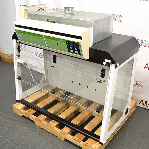Erlab M481 Captair Flex Ductless Fume Hood positioned on a wooden pallet, featuring a digital control panel, transparent front, and a green and white color scheme.