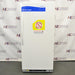 Straight-on studio view of a Fisher Isotemp laboratory refrigerator model 17LREEFSA standing upright on a grey floor against a branded backdrop, featuring a white door with a vertical handle, Fisher Scientific branding, and safety warning stickers